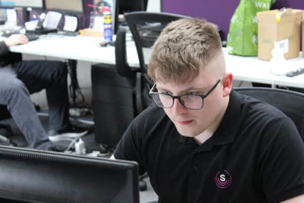 IT Technician sat at a computer